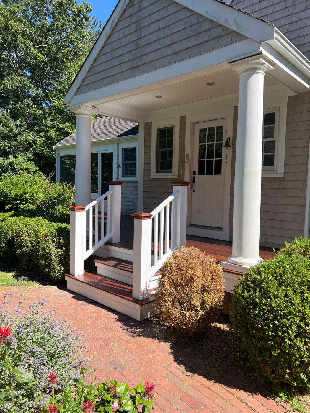 Front porch with columns built by Emerson Inc.
