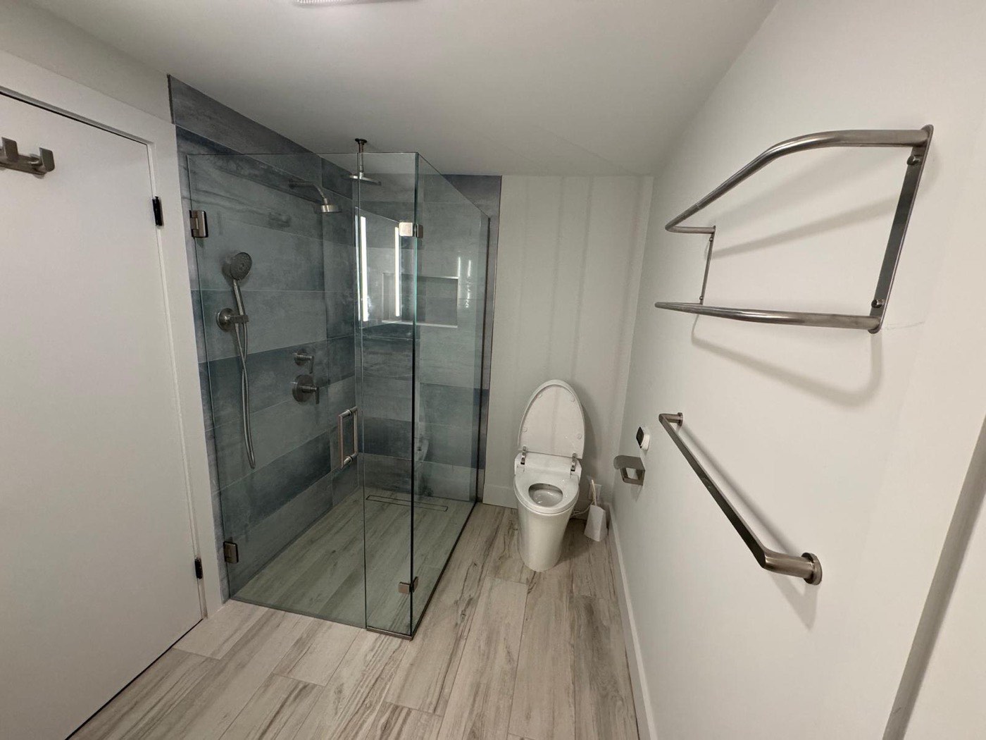 Bathroom remodel with glass shower and floating vanity