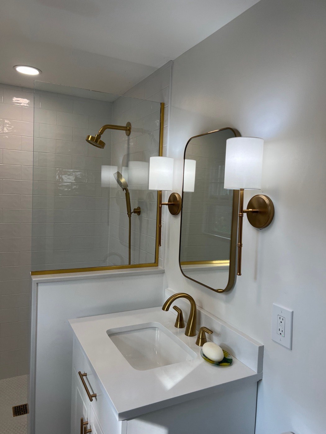 Bathroom remodel vanity with brass fixtures