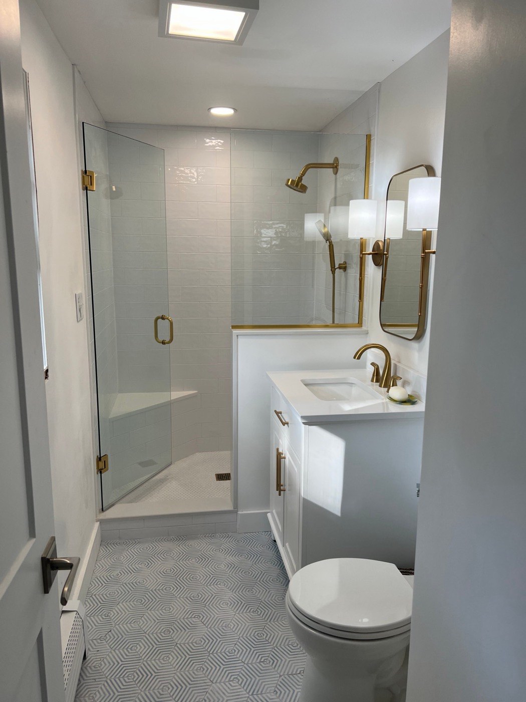 Bathroom remodel with glass shower and hex tile floor